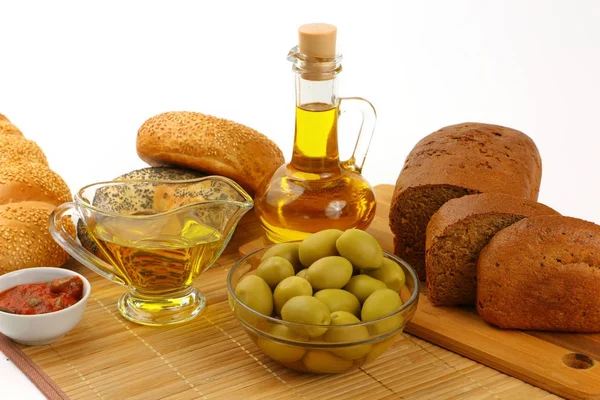 Still life with olive oil, olives and bread — Stock Photo, Image