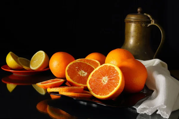 Still life with oranges, lemons and jug in a retro stylee — Stock Photo, Image