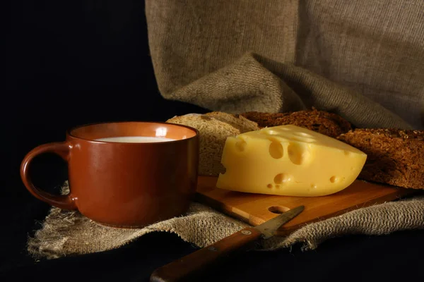 Milk and cheese in rustic style