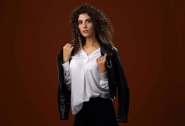 Beautiful girl in white blouse and black leather jacket — Stock Photo, Image