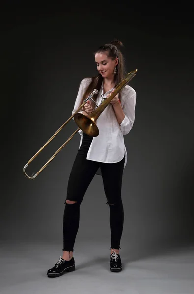 Cute girl with trombone — Stock Photo, Image