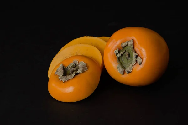 Fruta de cáqui com fatias — Fotografia de Stock