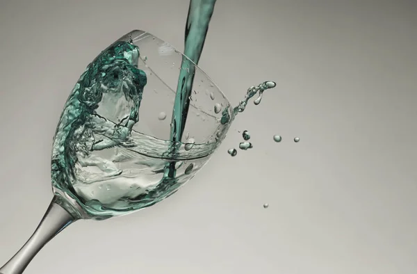 Water splash op een glas — Stockfoto