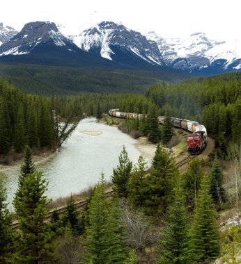 Canadian Pacific Train Traveling through the Rocky Mountains clipart