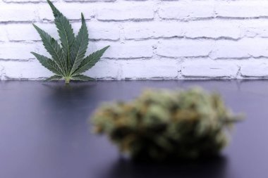 Unfocused cannabis bud and marijuana leaf clipart