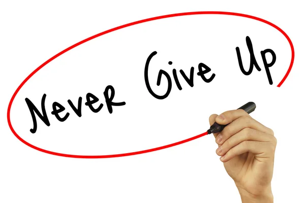 Man Hand writing Never Give Up con marcador negro en solapa visual —  Fotos de Stock