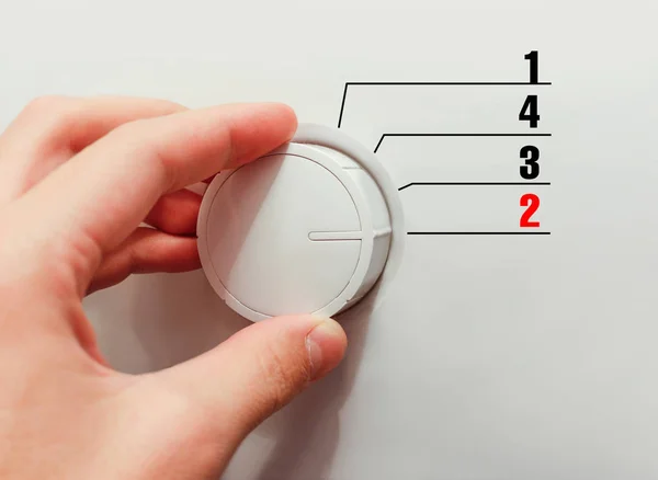 Male hand turns the switch. Switches figures. Chose the number 2 — Stock Photo, Image