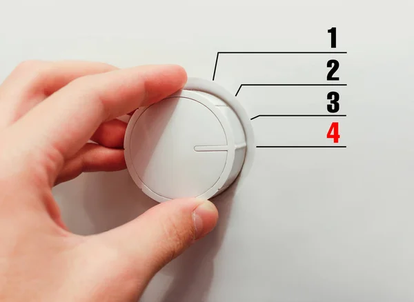 Male hand turns the switch. Switches figures. Chose the number 4 — Stock Photo, Image