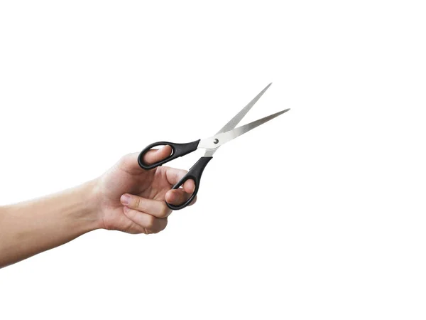 Scissors in hand. Isolated on grey background — Stock Photo, Image