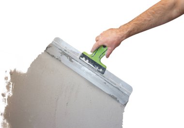 Elini onarım odasında spatula ile. Sıvacı işçi ali