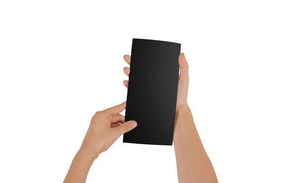 Manos sosteniendo en blanco folleto negro folleto en la mano. Prospecto —  Fotos de Stock
