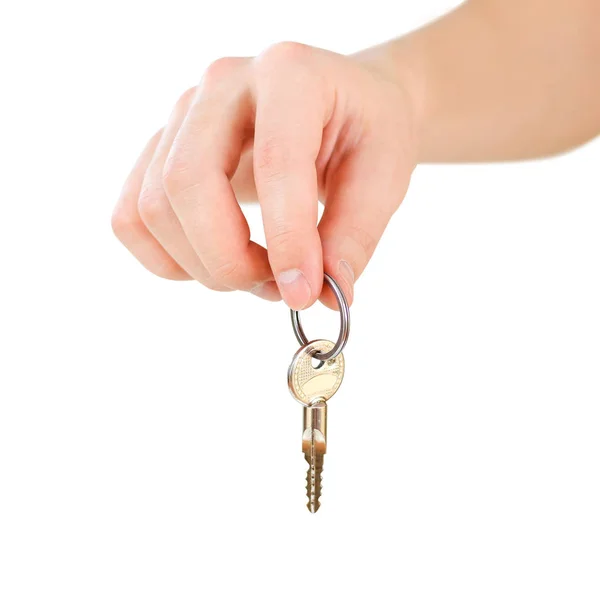 Ruka drží klíče. Izolované na bílém pozadí. — Stock fotografie