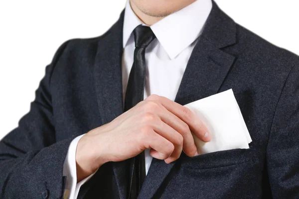 Fechar a mão coloca um lenço branco no bolso de sua bla — Fotografia de Stock