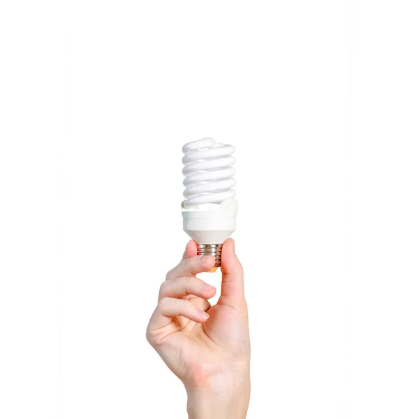 Närbild av mannens hand hålla energisparande lampa. Återvinning, ele — Stockfoto