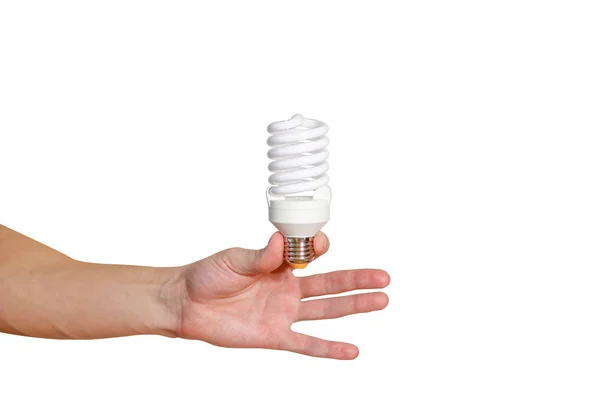 Крупный план руки человека, держащего энергосберегающую лампу. Переработка, переработка — стоковое фото