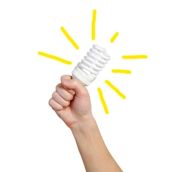 Крупним планом рука людини тримає енергозберігаючу лампу. Яскраво-жовтий — стокове фото