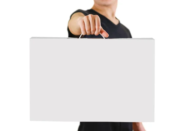 Man showing blank white big A2 paper. Leaflet presentation. Pamp