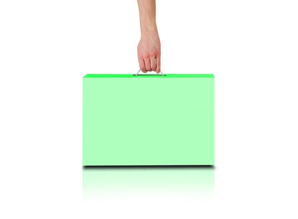 手中握有一个绿色的盒子，用句柄。笔记本电脑的包装盒子。St — 图库照片