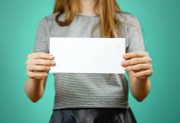 Woman showing blank white flyer paper. Leaflet presentation. Pam