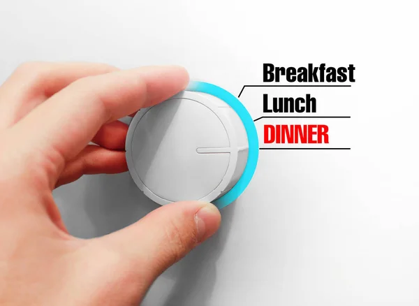 Male hand turns the switch. Switches mealtimes. Chose the Dinner — Stock Photo, Image