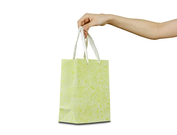 Hand holding a gift bag. Isolated on white background — Stock Photo, Image