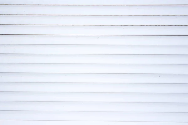 La texture delle tende metalliche bianche. Orizzontale. Primo piano — Foto Stock