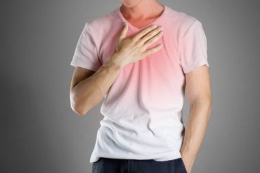 Meme üzerinde elini tutarak Beyaz gömlekli adam. H ağrı