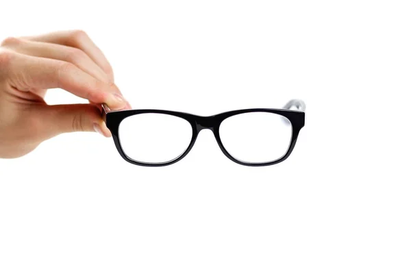 Hand håller öppet glasögon för korrigering av synen. Isolerade — Stockfoto