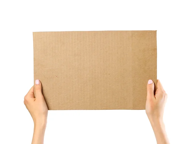 Hands holding a piece of cardboard. Isolated on a white backgrou — Stock Photo, Image