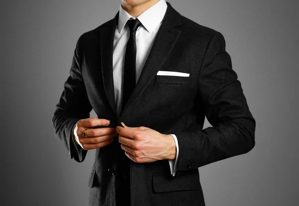 Businessman in a black suit, white shirt and tie. Studio shootin — Stock Photo, Image