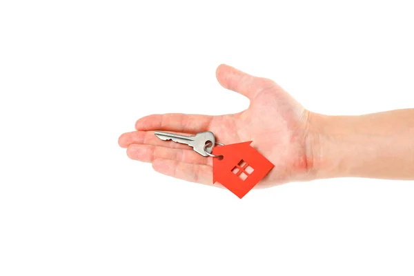 Rukou drží klíčů s klíčenkou červený dům. Nákup — Stock fotografie