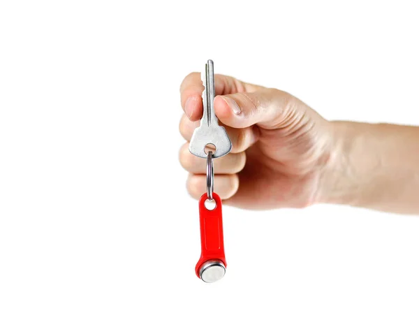 Handen Håller Nycklarna Till Lägenheten Med Ett Chip Närbild Isolerad — Stockfoto