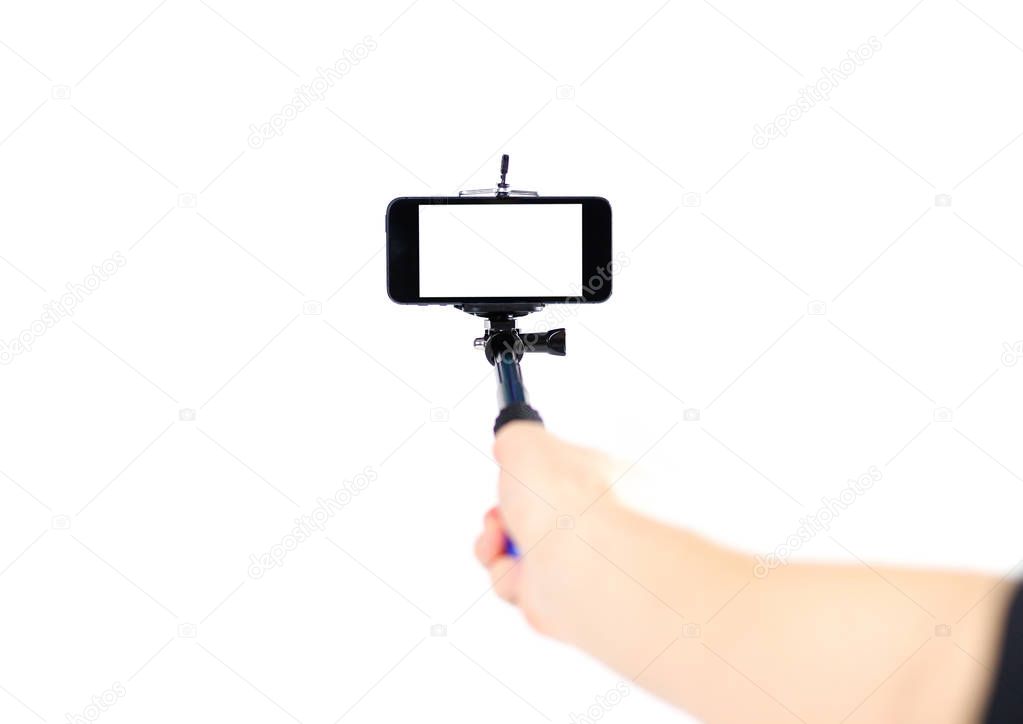 Selfie stick for phone. Close up. Isolated on white background.