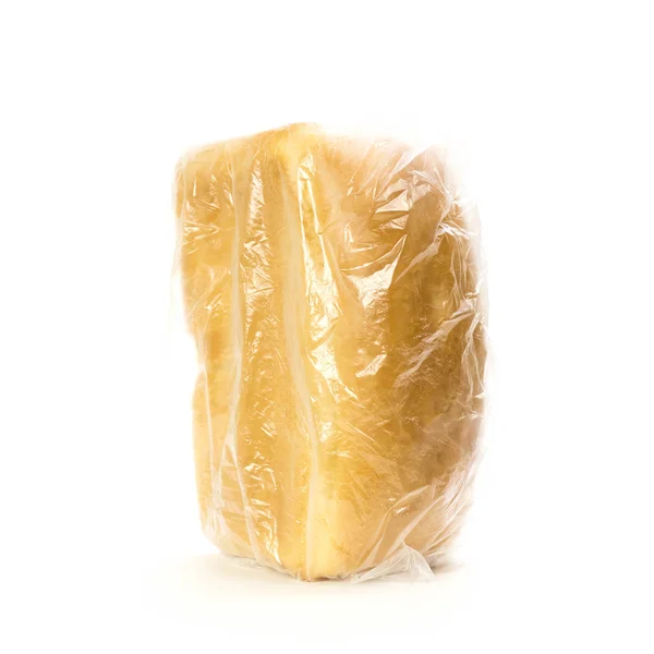 Egy vekni friss kenyér egy zacskóban. Közelről. Fehér háton elszigetelve — Stock Fotó