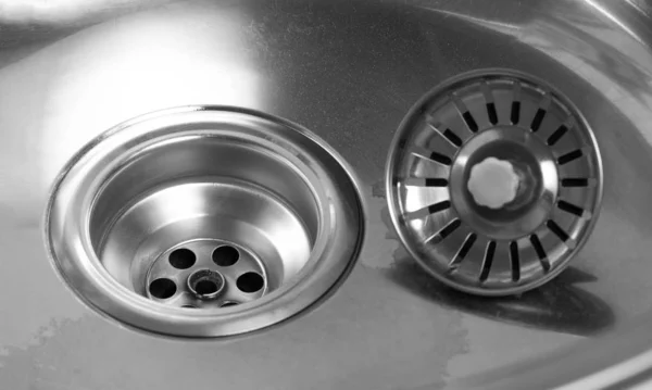The middle of the metal kitchen sink. Close up — Stock Photo, Image