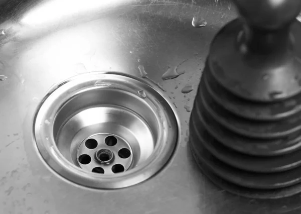 Plunger in the sink. A tool for cleaning clogs in sinks. Close u — Stock Photo, Image