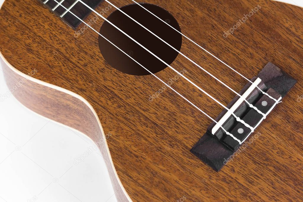 Bridge at ukulele. Close up. Isolated on white background