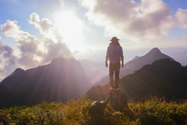 Man on the top of the hill watching wonderful scenery — Stock Photo, Image