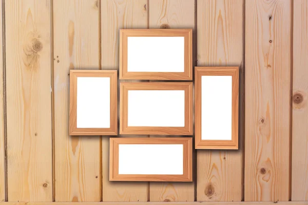 Group of blank wood picture frame on the modern wooden wall with — Stock Photo, Image