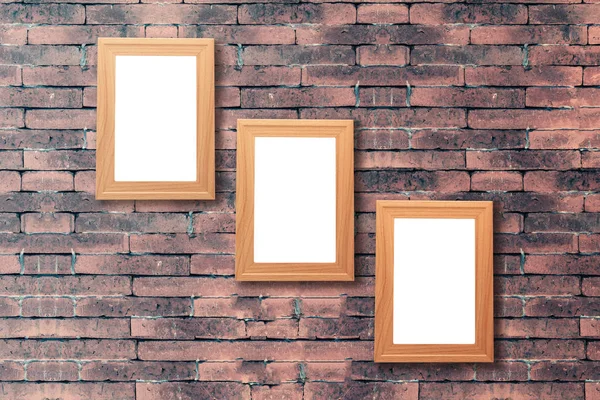 Group of blank wood picture frame on the old brick wall with cop — Stock Photo, Image