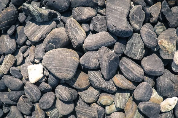 Fondo abstracto con guijarros de mar negros y grises - mar redondo —  Fotos de Stock