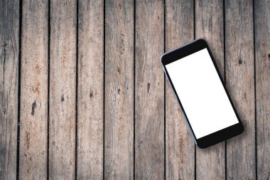 eski ahşap masa boş akıllı telefon üstten görünüm görüntüsü. hazır 