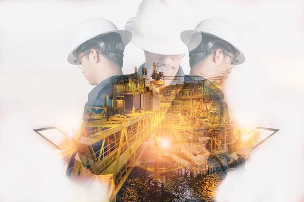 Mühendis veya teknisyen adamın güvenlik kask ile çift pozlama