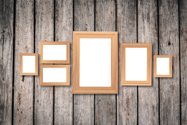 Collage of blank brown wooden frames , interior decor mock up on old wooden wall, vintage style.
