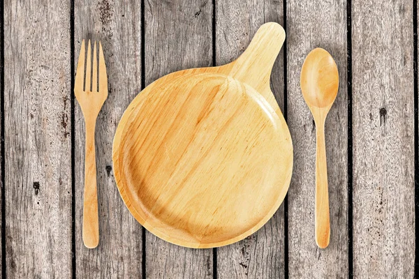 Üstten Görünüm mutfak eşyaları, ahşap tabak, çatal ve kaşık o ayarla