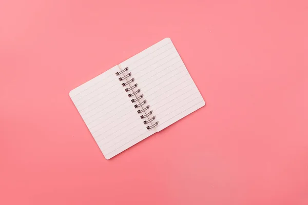 Blank notebook  on top of pink pastel desk. Top view with copy s — Stock Photo, Image