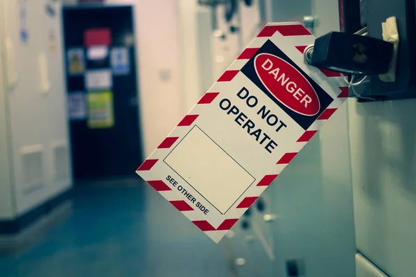 Red, white Lock out & Tag out for Lock station,machine - specific or switch gear roomd evices and safety first point, Cyber security or safety industrial concept.                      