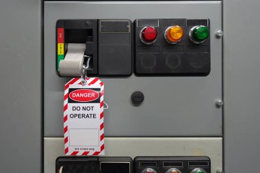 Red, white Lock out & Tag out for Lock station,machine - specific or switch gear roomd evices and safety first point, Cyber security or safety industrial concept.                      