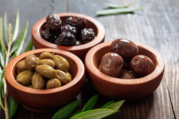 Variety of olives in bowls — Stock Photo, Image
