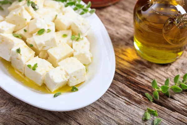 Feta cheece pieces on wooden background — Stock Photo, Image